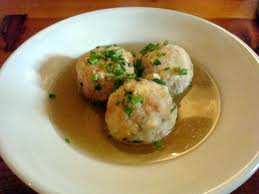 When water is right a bit under boiling temperature pour bread balls. Cook for 10-15 minutes, using low heat. Drain gently and serve with melt butter and grated parmesan cheese.