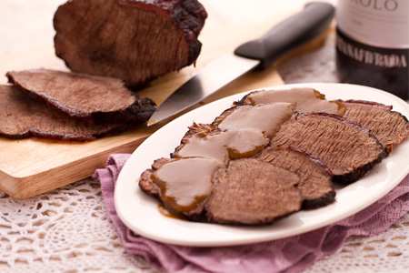 Salt and simmer for hours using very low heat. Cover the pan and close it very well, if necessary put a weight to keep the lid close.