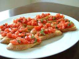 BRUSCHETTA from Capri (South Italy) Ingredients: Thick bread slices Tomatoes, buffalo mozzarella cheese, black olives Extra