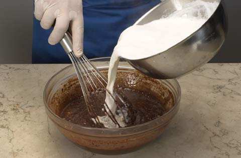 when candy, move moulds to cover entire bottom with melted sugar.in a medium bowl combine sugar, cocoa powder, whole egg, 2 yolks, crashed amaretti biscuits,, toasted hazelnuts and rum.