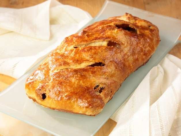 roll dough on it self beginning from filling side, help your self with dishcloth. Arrange strudel on a greased oven pan (greased with melted butter).