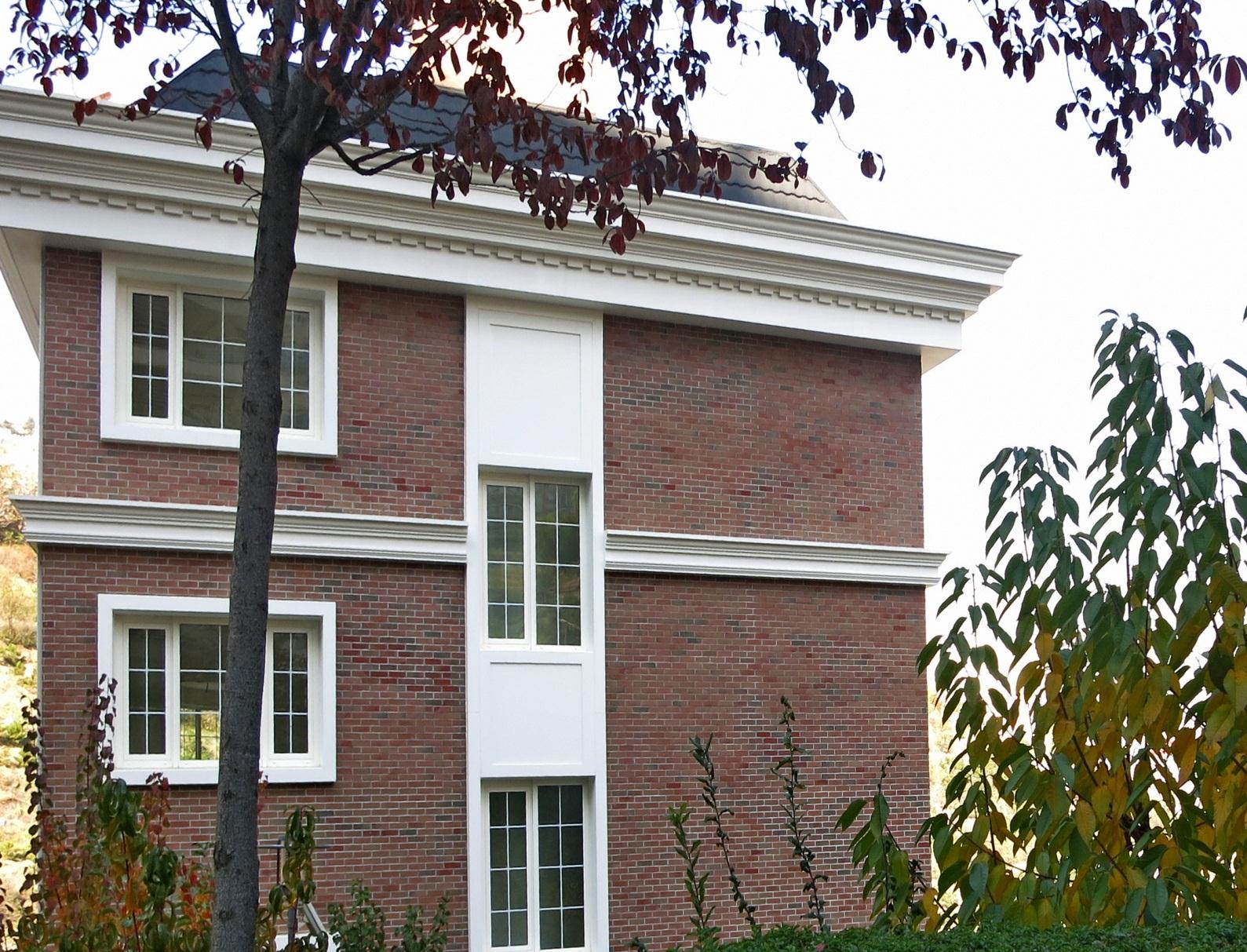 The building has two separate entrances from the street: the main entrance and a secure remote controlled indoor parking lot entrance.