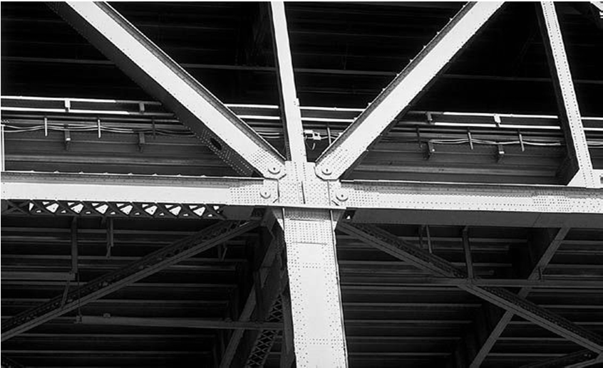 Continuous Span Beam Description: New Antioch Bridge. This high-level bridge completed in 1979 replaced an older truss-type lift bridge crossing the main shipping channel.