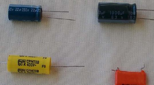 Elektronik devre elemanları Kondansatörler Karşılıklı iki iletken ve bunların arasında bulunan bir