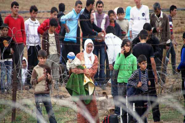 Uluslararası Göç Sorunu ve Türkiye Fotoğraf 4: Suriyelilerin Türkiye ye İlticası (2011) Kaynak: http://www.avrupagazete.com/dunya/7370-suriye-den-turkiye-ye-gecislerdurduruldu.html:09.