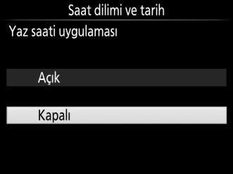 Makinenin saat ayarını yapmak için çoklu seçiciyi ve J düğmesini kullanın.