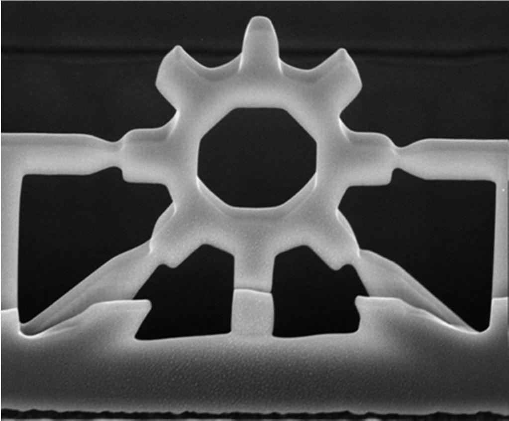 A focused ion beam created this two-micron-wide gear, seen here