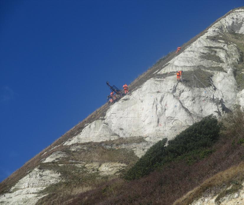 Rope access techniques in use for drilling and installation of