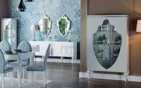 Soft pastel tones and accented mirrors play up the modern side of the Baron