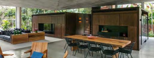 by verdant rainforests, this concrete home in Brazil fully opens Yükseltilmiş zemin ayrıca, ev sahiplerine evin çevresindeki en göz alıcı ağaç ve bitki up to the elements. manzaralarını sunuyor.