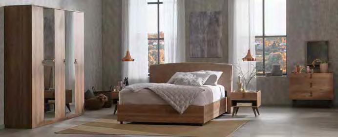 .. Yatağın sade formu, şifonyer ve komodinin özgün tarzıyla
