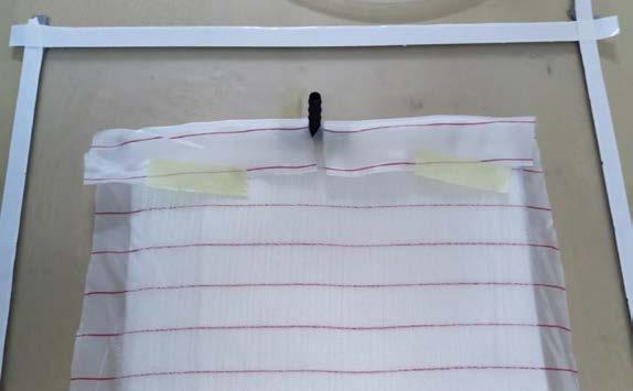 Uzun kesilen sök-at kumaşı spiral hortum etrafına sarılır ve sabit kalması amacıyla kâğıt bant yapıştırılır (Şekil 2.