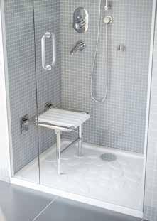 Grab rails and shower seat located in the shower area ensure safety for elderly and disabled users.