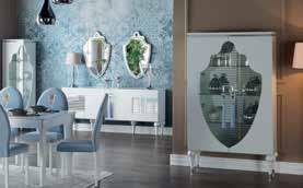 Soft pastel tones and accented mirrors play up the modern side of the Baron