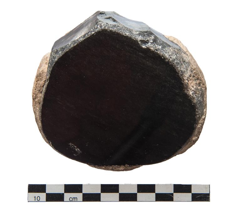 (Left) Obsidian mirror from burial in B.