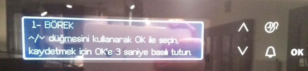 Pişirme programı kaydedilirken ok tuşları ve OK tuşu ile kaydedilen programa kişisel isim