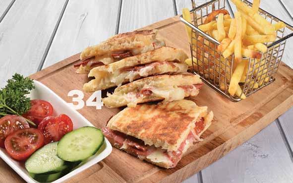 17,00 tl Karışık Bazlama Tost 31 Beyaz Peynirli Bazlama Tost Bazlama ekmeği içerisinde beyaz peynir, domates, yanında patates kızartması ve domates, salatalık söğüş ile servis edilir.