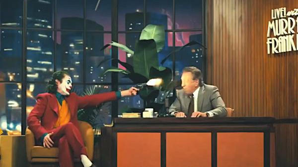 46 Derya OĞUZ Görüntü 5-6: Joker in ünlü şovmene canlı yayında ateş ettiği görüntü ve şehrin durumu Sembolik