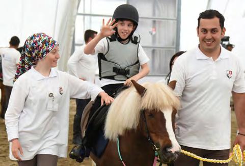 Merkezlerinde, engelli ve down sendromlu çocuklar için At ların iyileştirici gücü kullanılarak alternatif bir