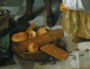Resmin sağ alt köşesinde bir natürmort sanatı örneği görüyoruz. Steen, bir sehpanın üzerine yerleştirilmiş yiyecekleri resmediyor.