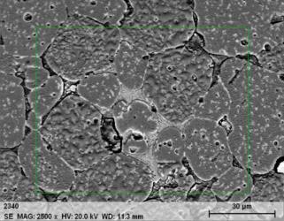 MgO-Spinel tuğlada periklas taneleri (a: SEM görüntüsü, b: Mapping analizi). (MgO-Spinel refractory periclase grains (a: SEM image, b: Mapping analysis)) 3.