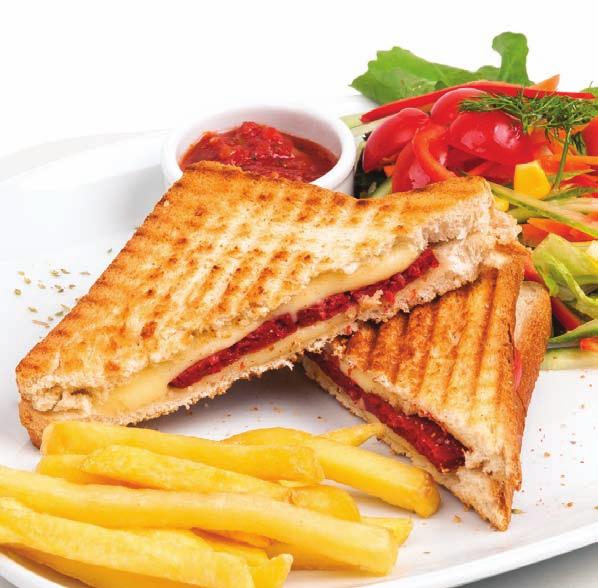 tostlar kaşarlı tost sucuklu tost karışık tost kare tost ekmeği içerisinde salam, sucuk, kaşar peyniri, yanında mevsim yeşillikleri, patates kızartması ve ezme sos ayvalık tostu kare tost ekmeği