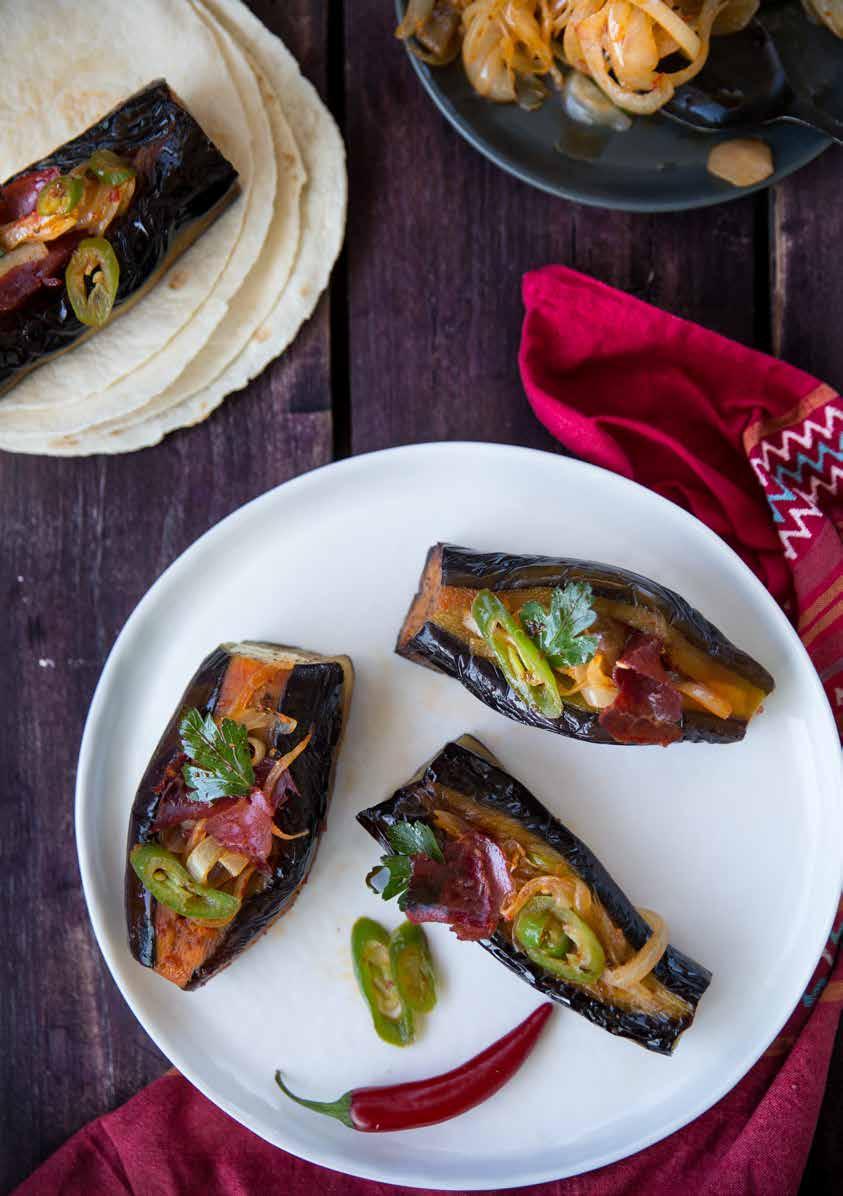 İmambayıldı being traditional eggplant food is especially the popular taste of summer tables. We hope that you will like its version cooked with pastrami. Peel eggplants as multicolored.