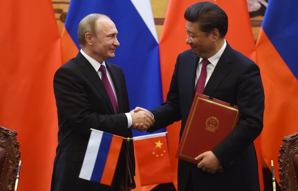 Rusya Devlet Başkanı Vladimir Putin ve Çin Devlet Başkanı Xi Jinping Ortaya çıkan Çin ve Rusya stratejik ortaklığı, Rusya ve Çin i dünyanın multi-disipliner yani çoklu kutuplaşmaya geçişini yansıtan